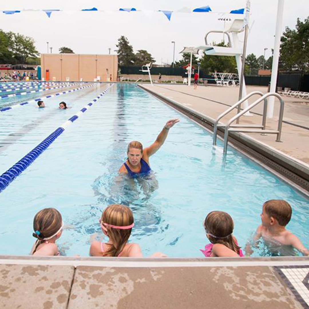 Instructor teaching kids good stroke technique
