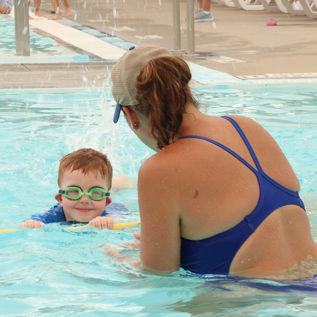 Instructor in the pool with toddler