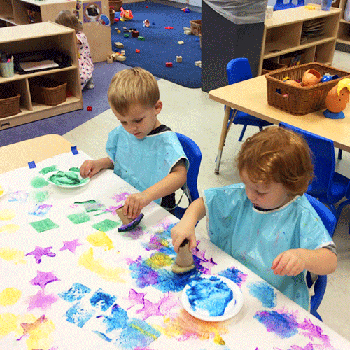 Kids making stamp art
