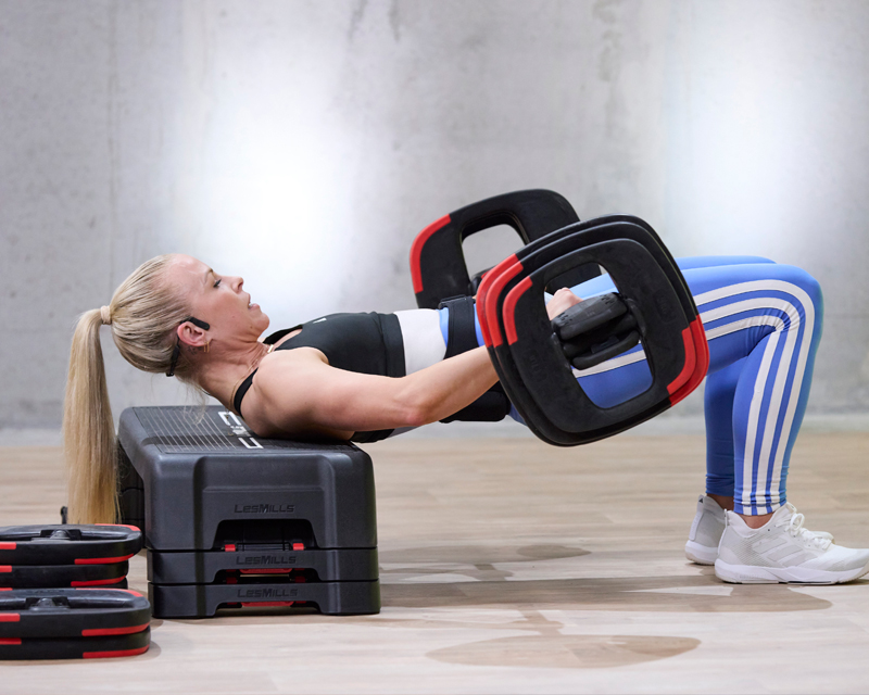Woman lifting weights on a barbell