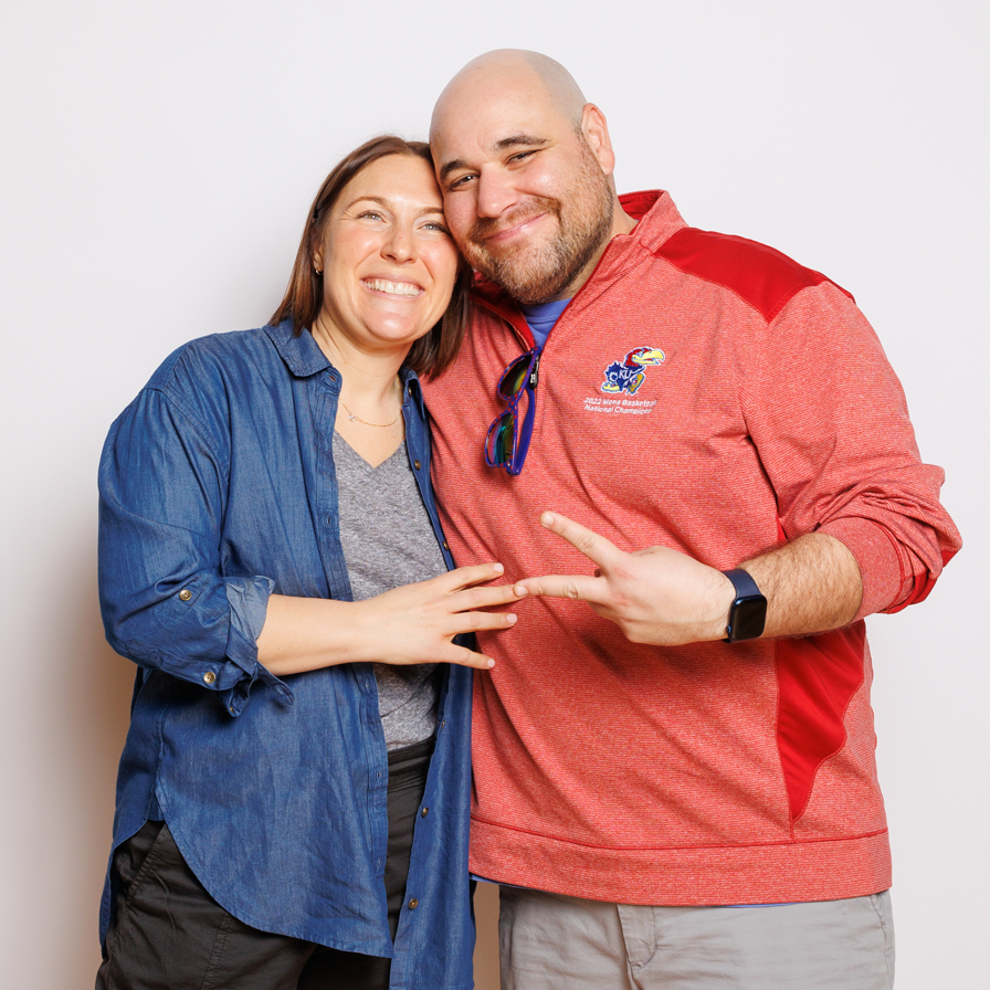 A happy couple poses at a Purim celebration