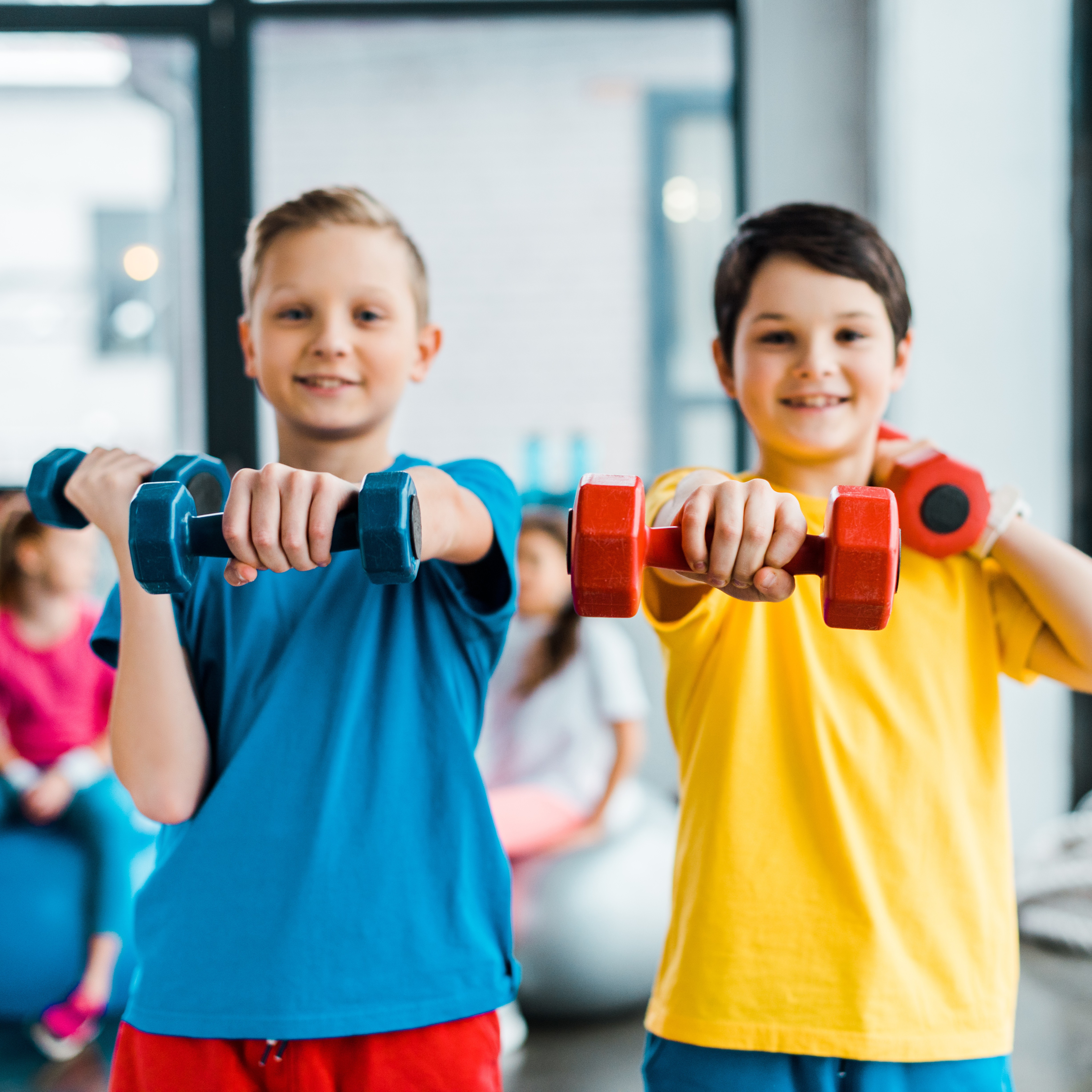 Boys and girls stretching on yoga mat