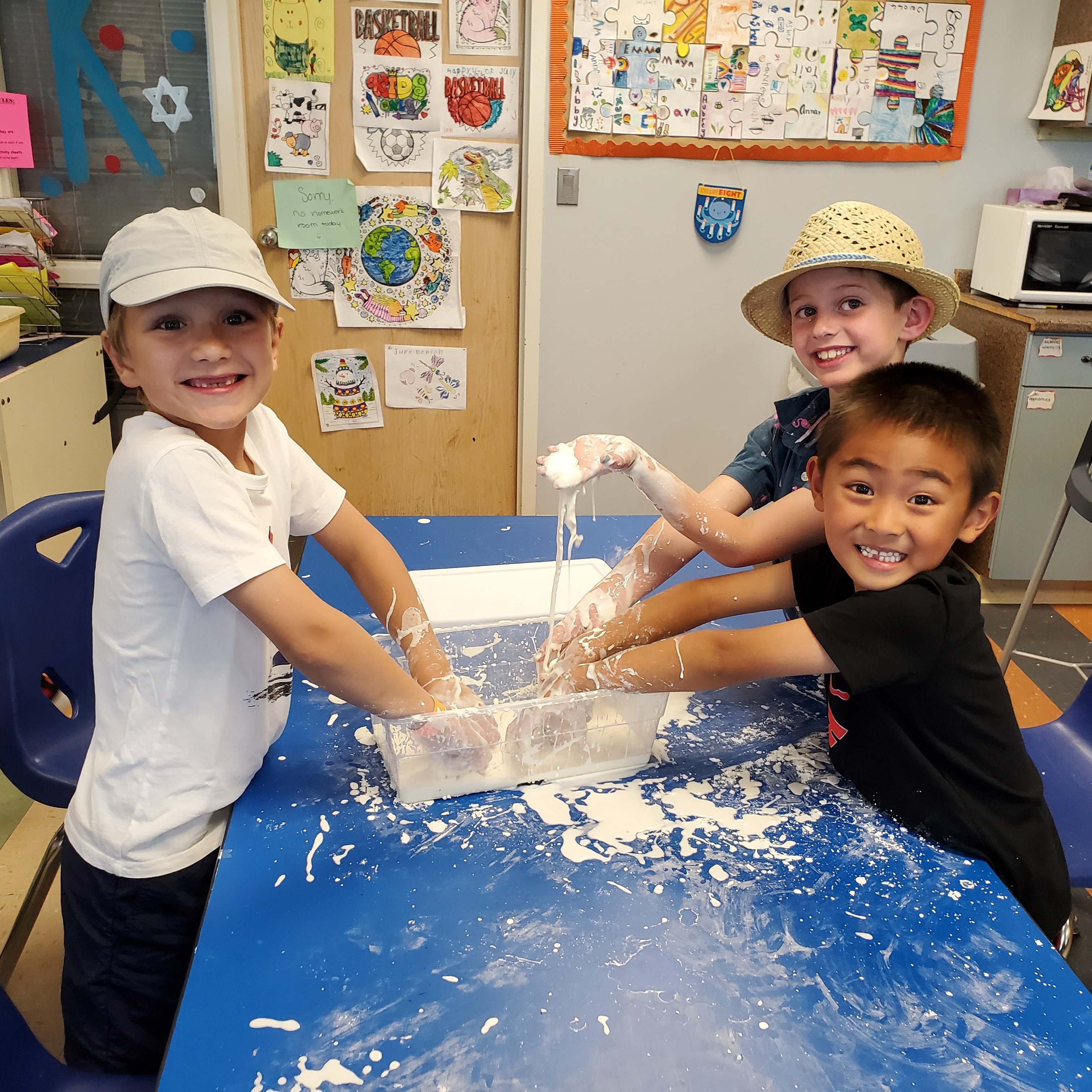 Boys with hands in flour