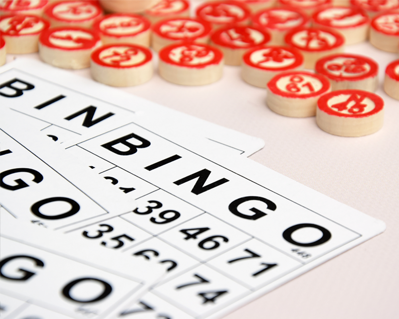 Photo close up of a Bingo card and markers