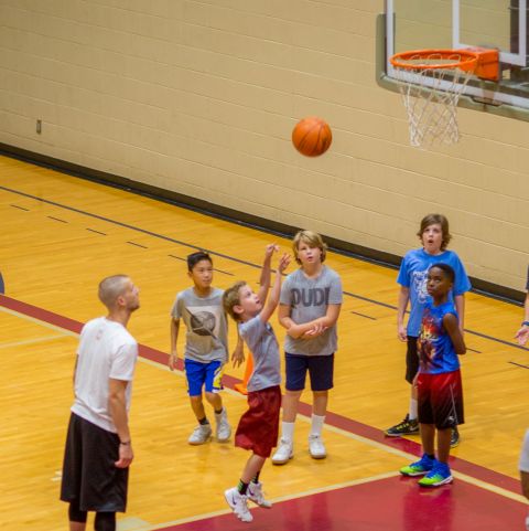 Boy taking a basketball shot