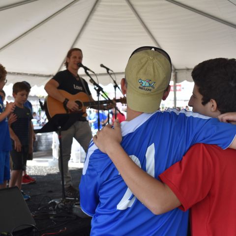 People listening to live performing artists
