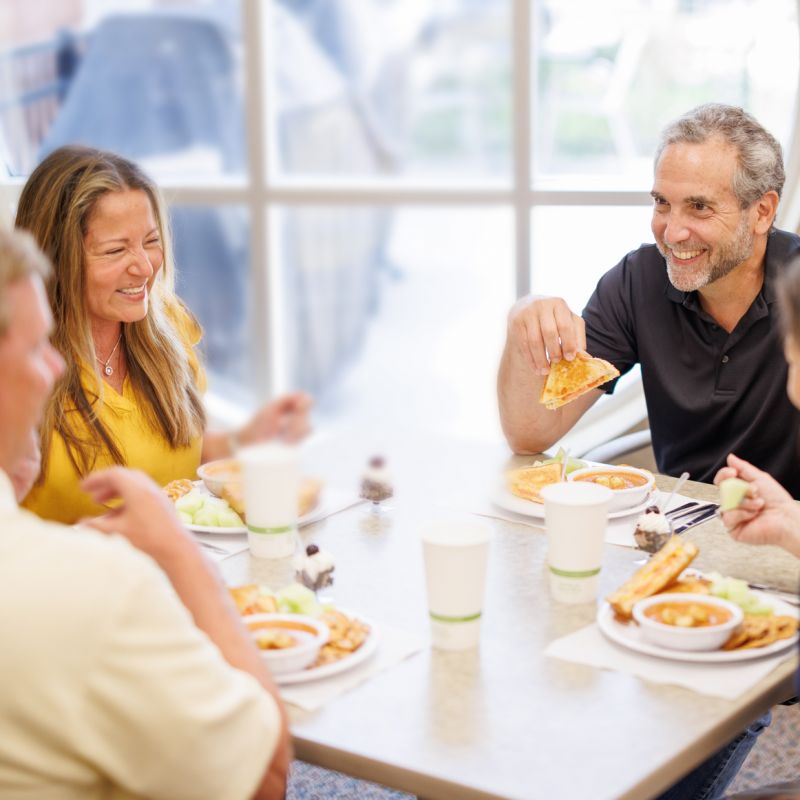 Men and women eating lunch,