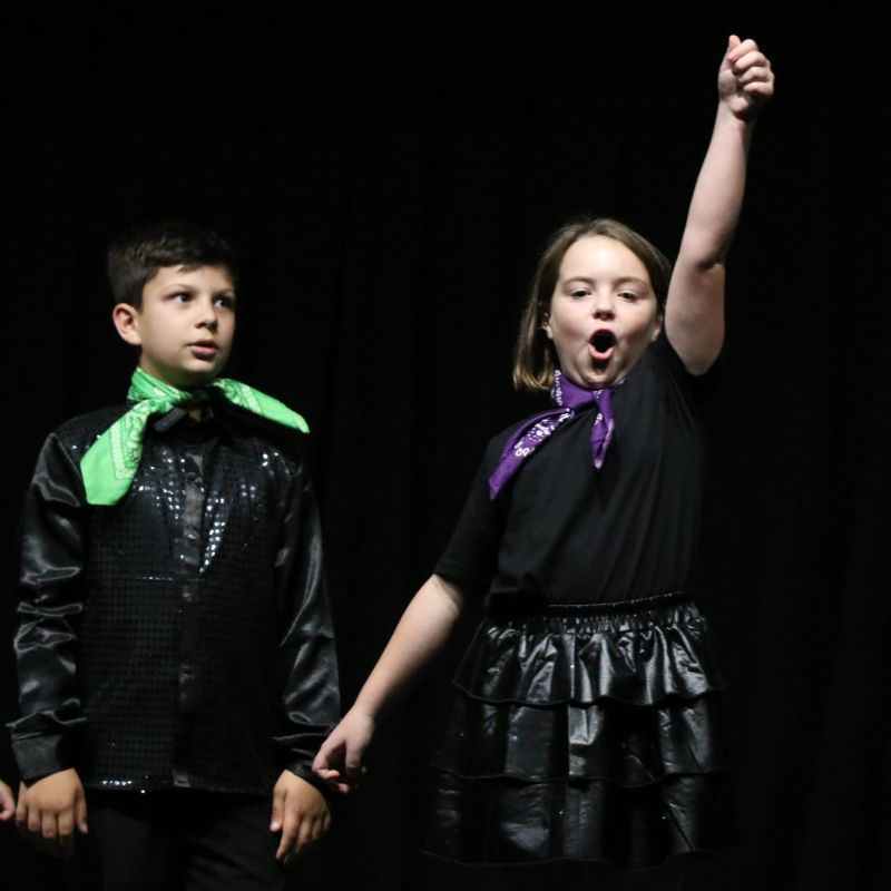 Girl singing and pointing in the air