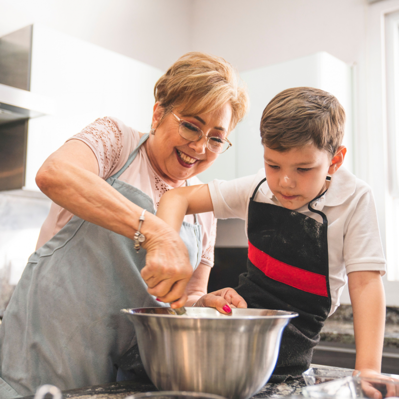 Grandma cooking with grandchild