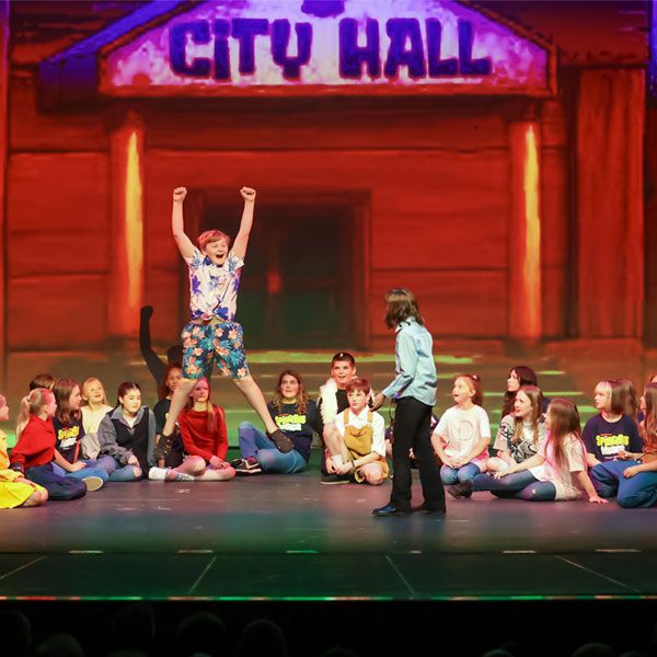 Kids in a production of The SpongeBob Musical